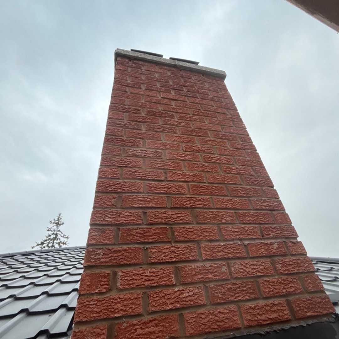 Professional chimney repair services showing crown replacement in Ontario
